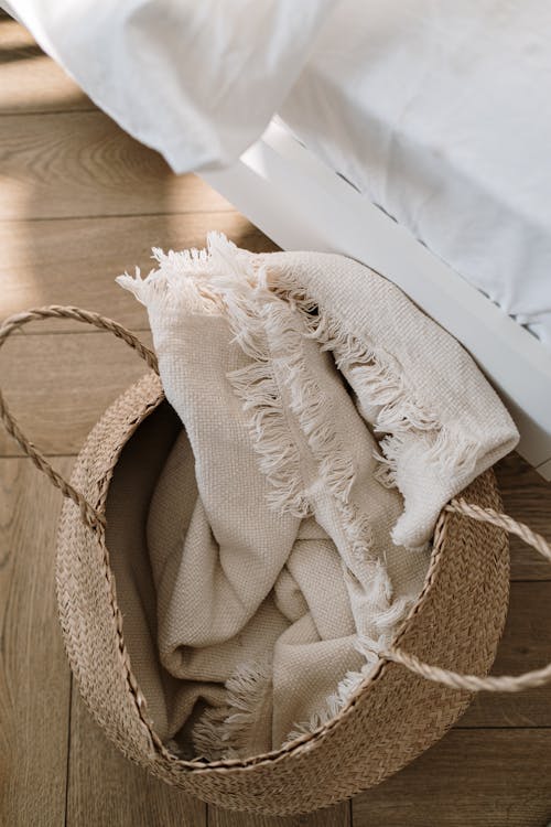 Free White Blanket on Brown Woven Basket Stock Photo