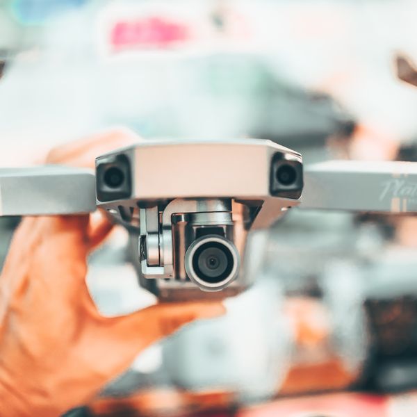 Professional drone pilot operating a drone in the city