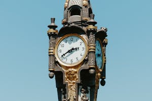 Classic clock in clear blue sky
