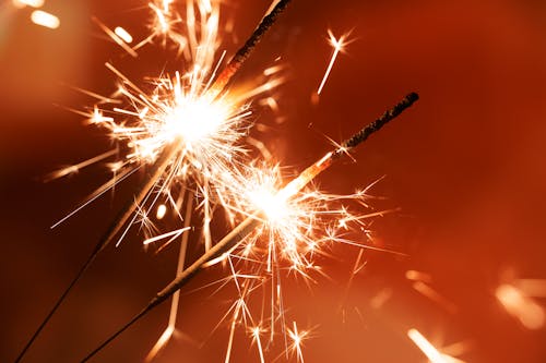 Two Burning Sparklers in Close-Up Photography