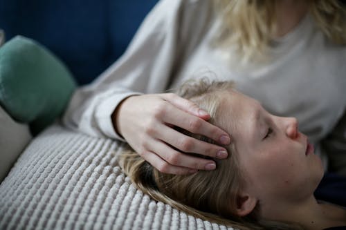 Free A Boy Lying on the Couch Stock Photo