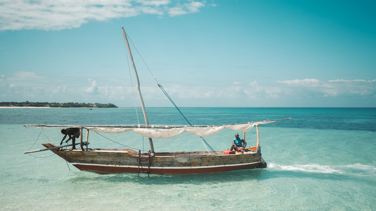 Two men on a fishing boat, Kenya