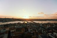 City Buildings Under Cloudy Sky during Sunset
