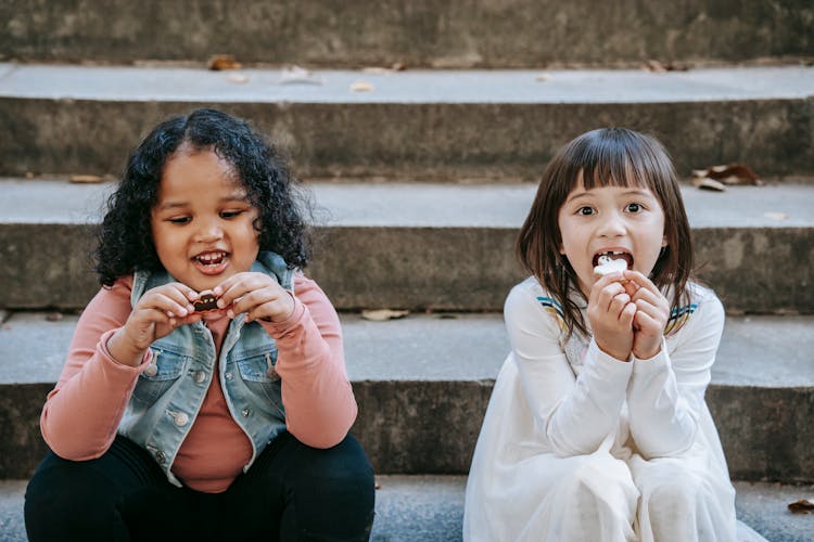 Diverse Kids Eating Ghost Shaped Cookies