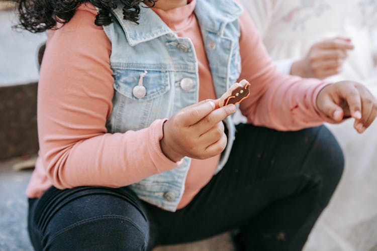 Ethnic Girl Having Halloween Cookie With Friend