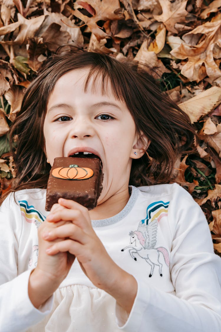 Hungry Little Girl With Sweet