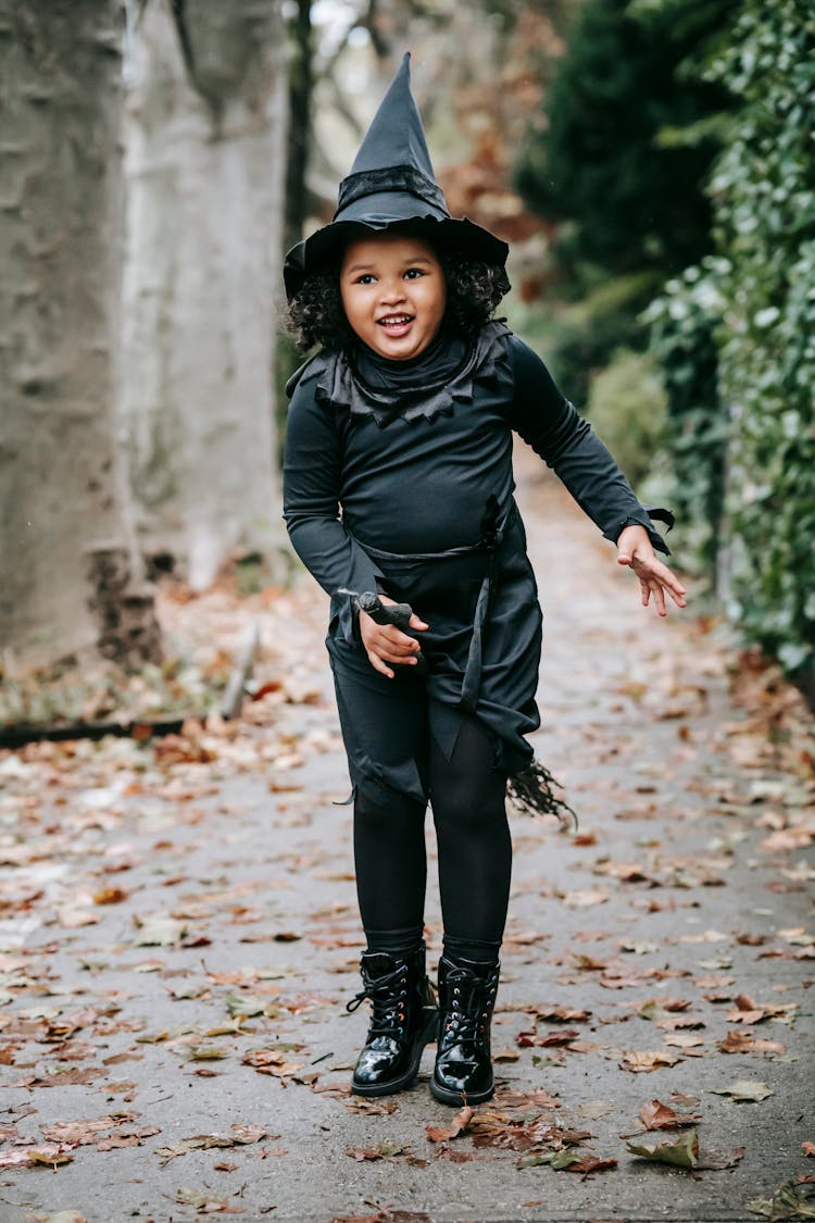 Happy Preschool Girl In Halloween Party Costume