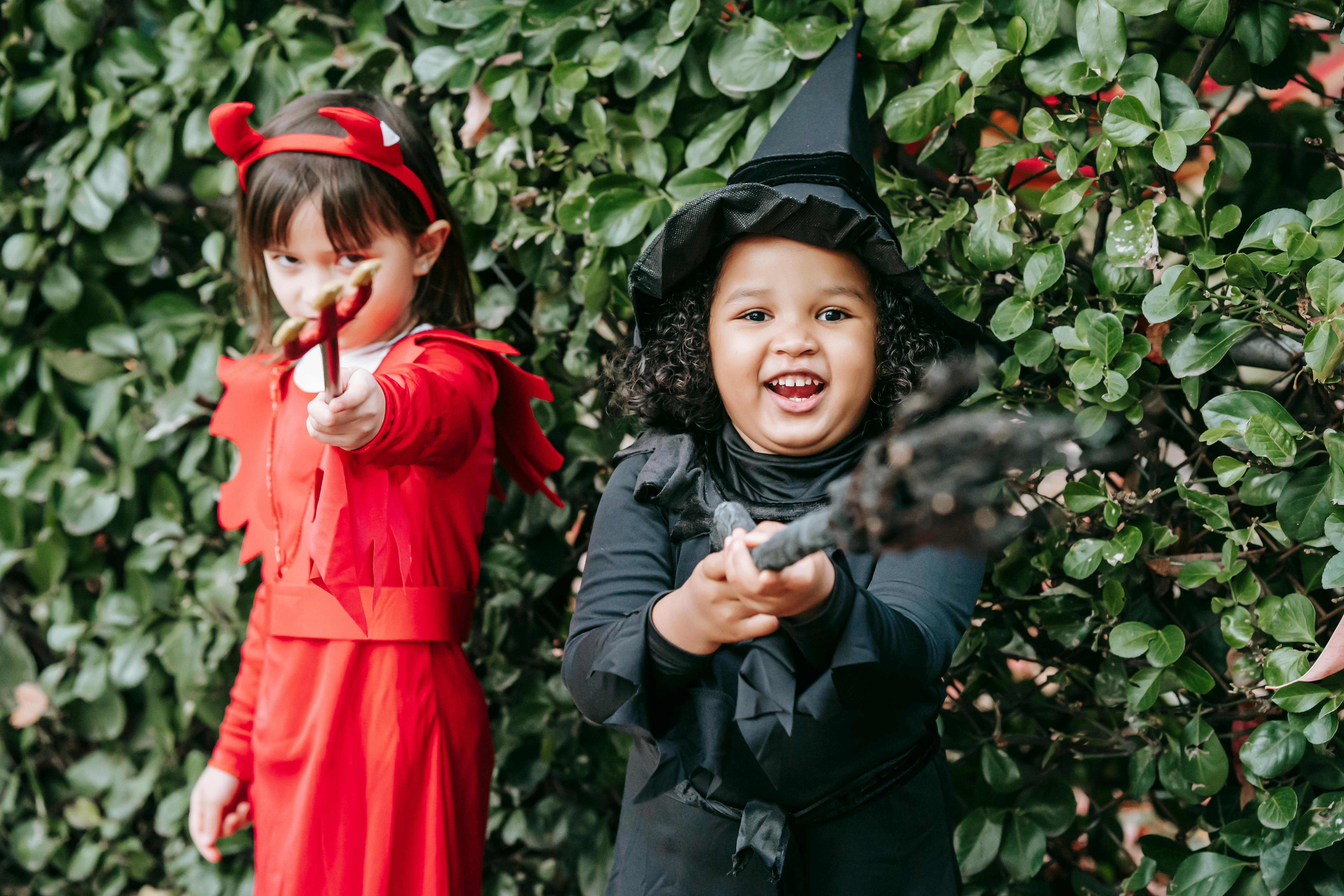 happy multiethnic little girls on halloween