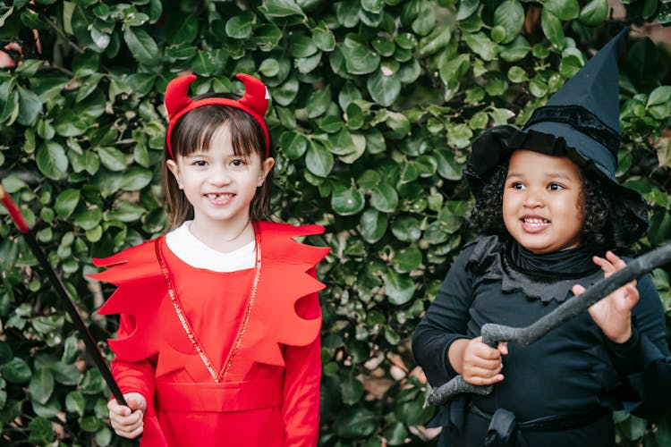 Cute Little Girls In Costumes On Halloween