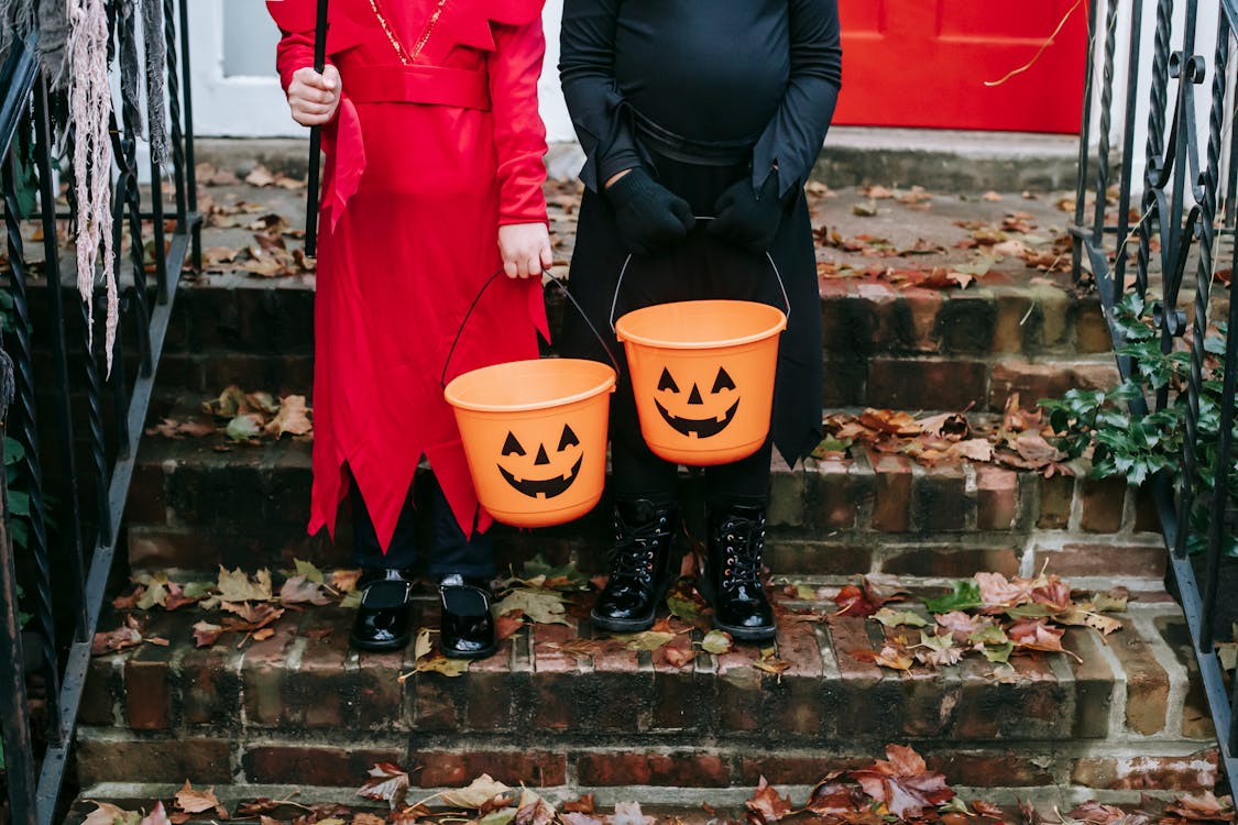 Children Holding a Halloween Design Buckets