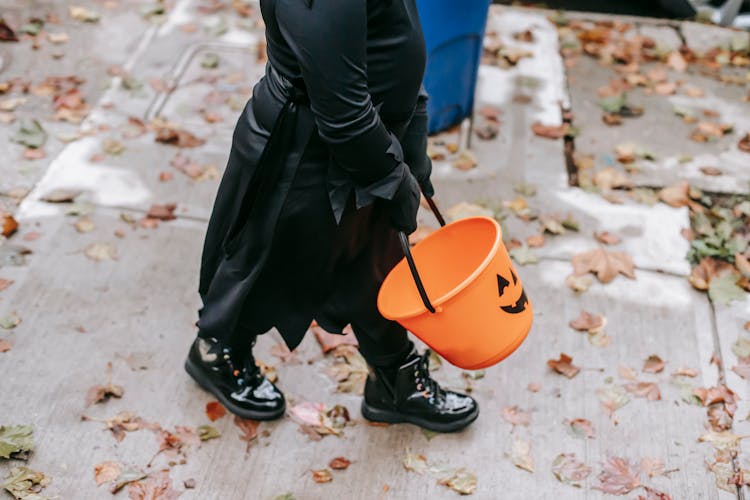 Faceless Kid In Witch Costume Trick Or Treating Outdoors