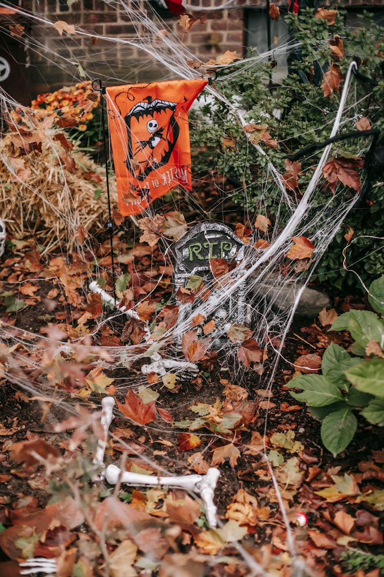 Fake Bones And Grave In Yard On Halloween