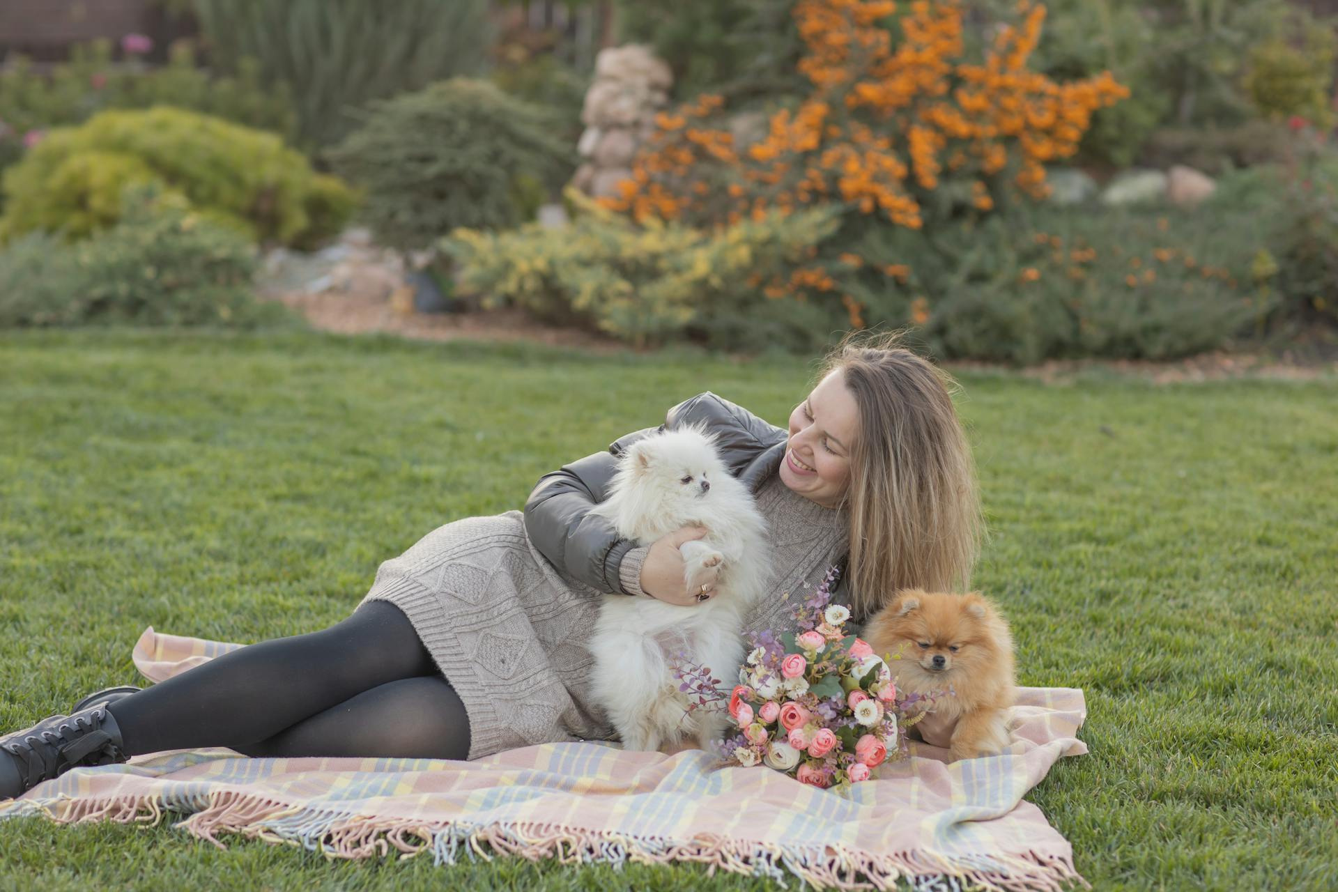 Woman Holding Dogs