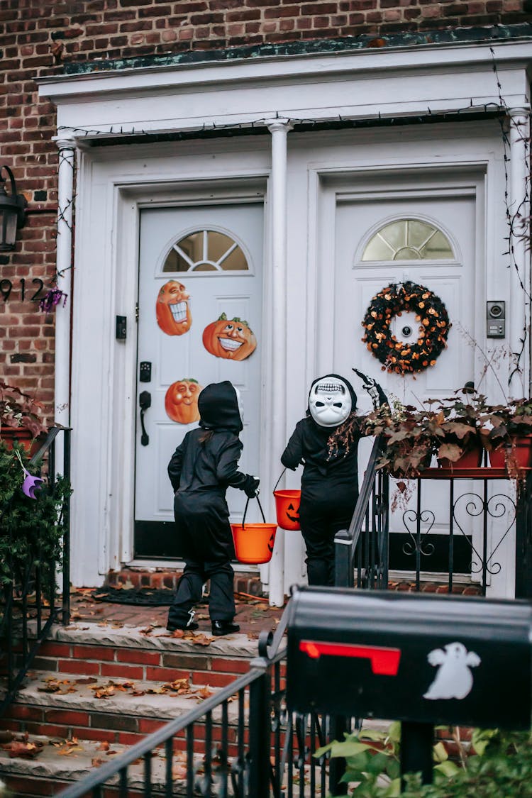 Anonymous Kids In Halloween Costumes Trick Or Treating