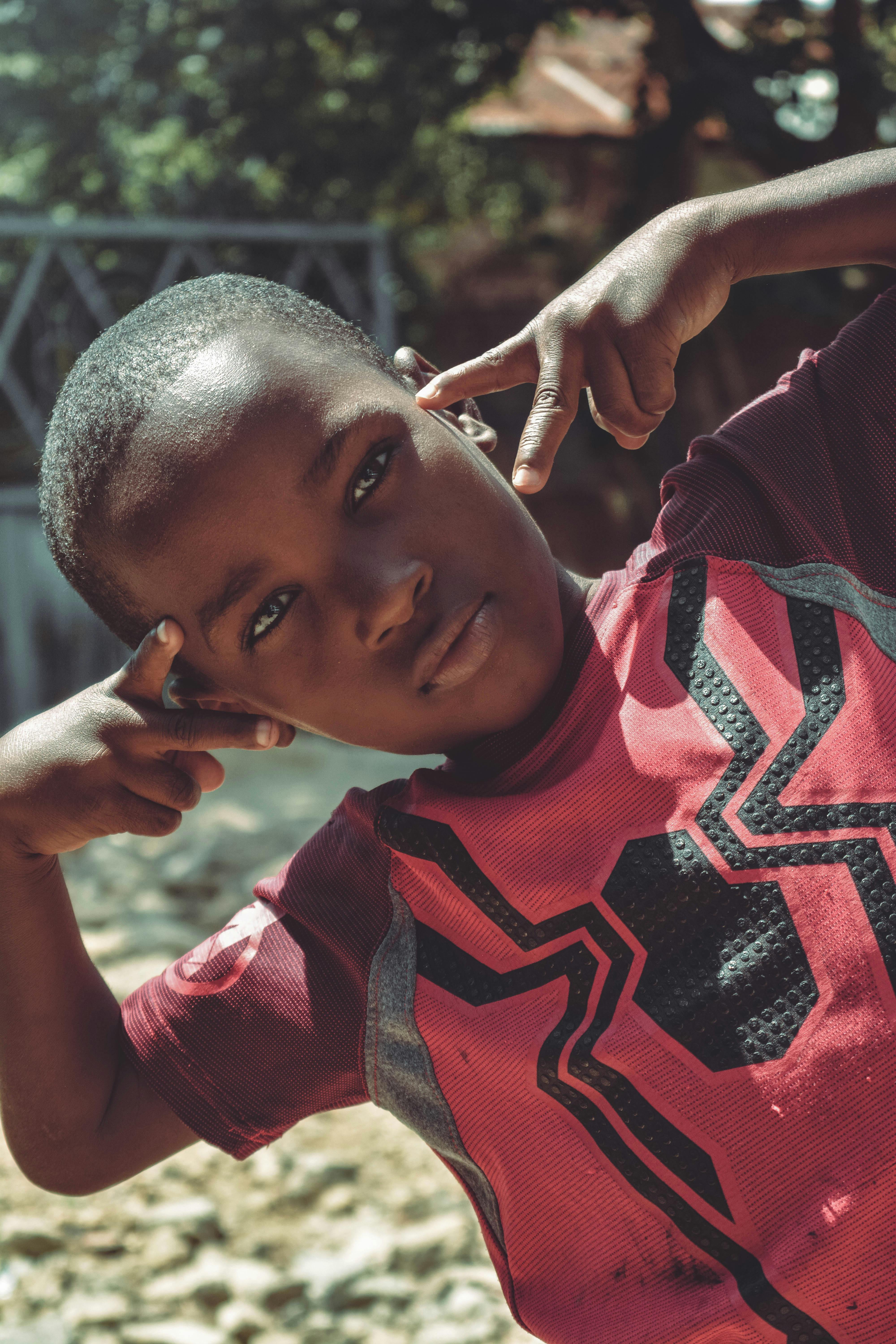 Boy Wearing Red Shirt During Daytime · Free Stock Photo