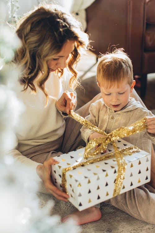 Free Mother and Son Opening a Gift Stock Photo