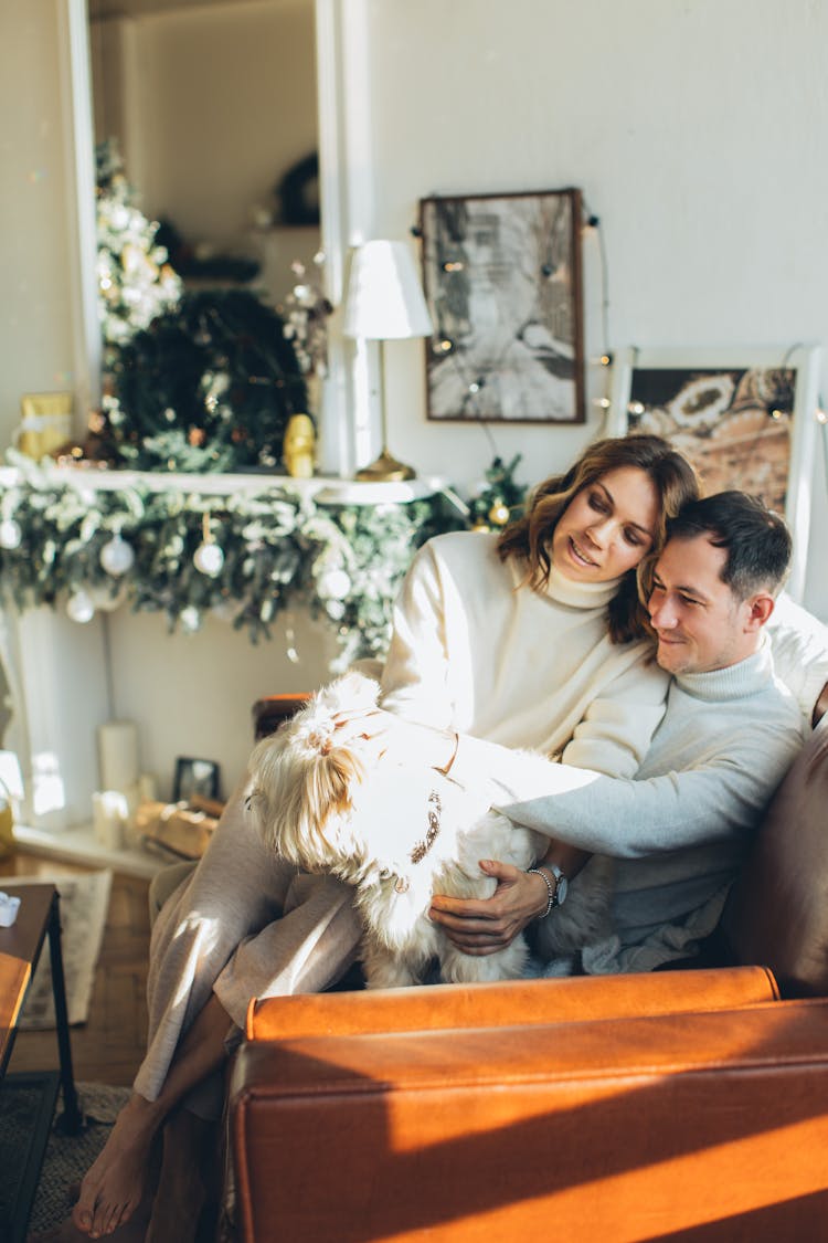 Couple Petting Their Dog