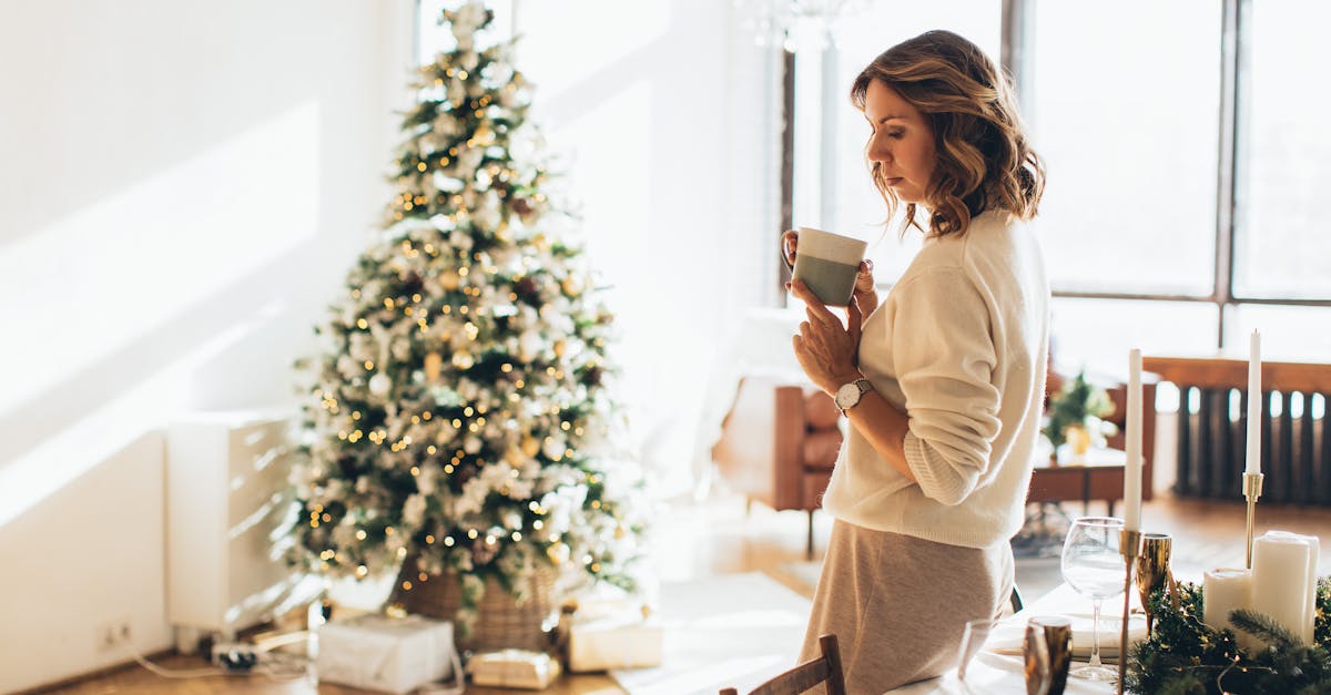 Woman relaxing with coffee by Christmas tree in cozy holiday setting
