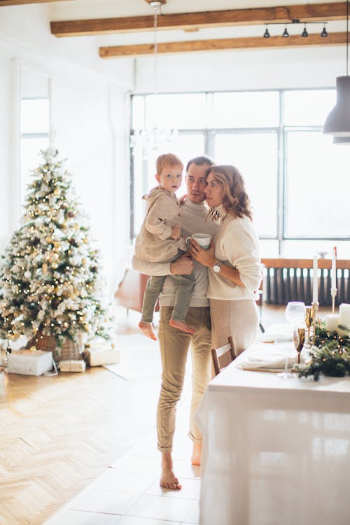 Family Standing in Living Room on Xmas