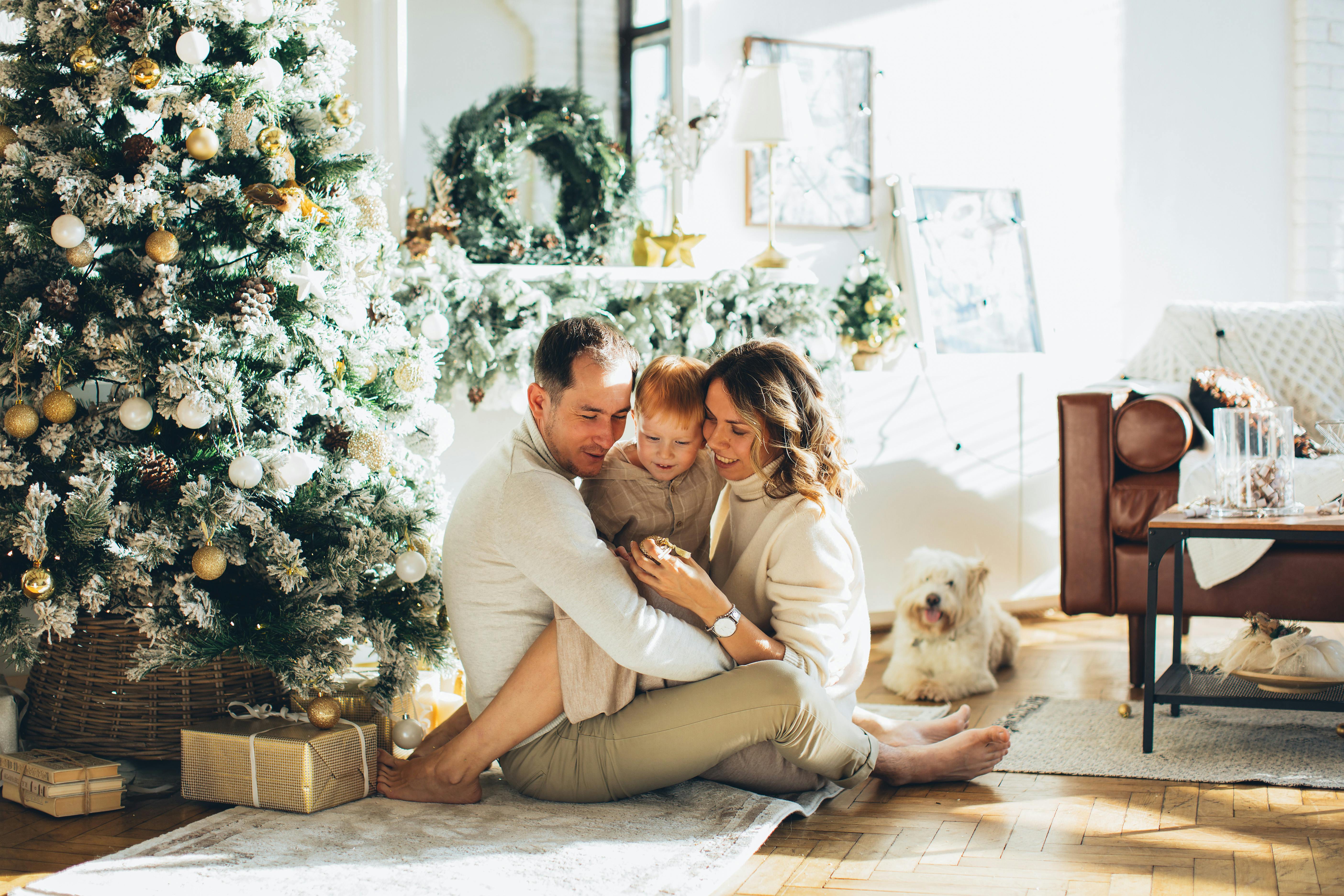 Family Sitting Beside A Christmas Tree Free Stock Photo   Pexels Photo 5860058 