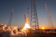 Spacecraft launching into orbit during sundown