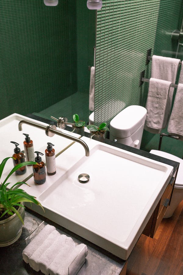 White Ceramic Sink with Stainless Steel Faucet
