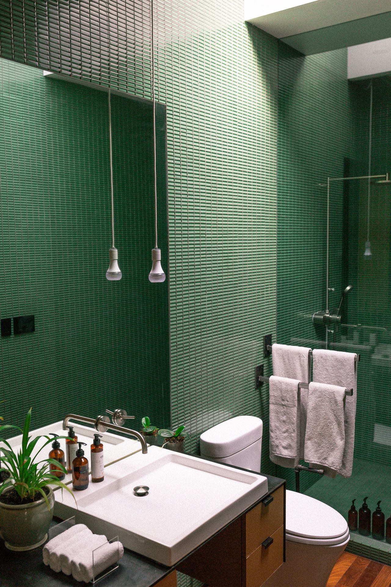 emerald-green-bathroom Bathroom with green tiled walls and white vanity