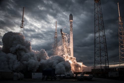 Free Space rocket taking off on overcast day Stock Photo