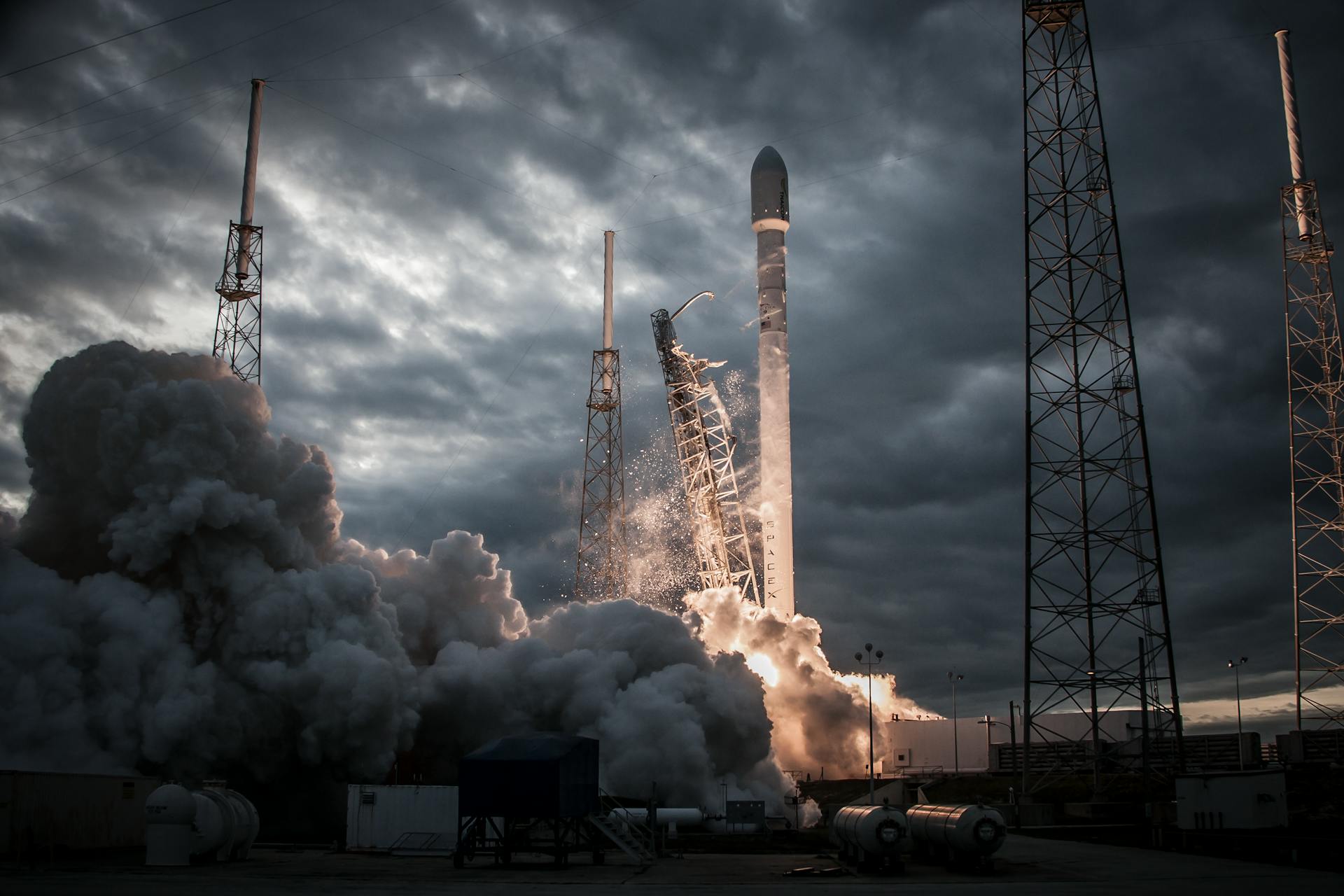 Space rocket taking off on overcast day