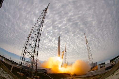 Rocket launch from spaceport on cloudy day