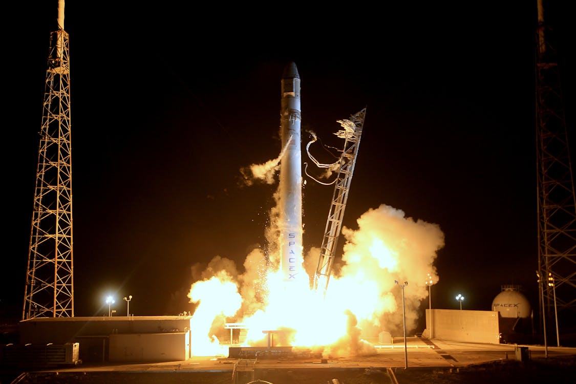 Free Night rocket liftoff into outer space Stock Photo