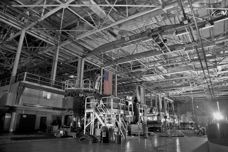 American Flag Hanging In Industrial Futuristic Factory