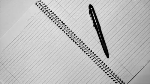 Free Pen on Notebook Stock Photo