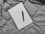 Black Pen on Spiral Notebook