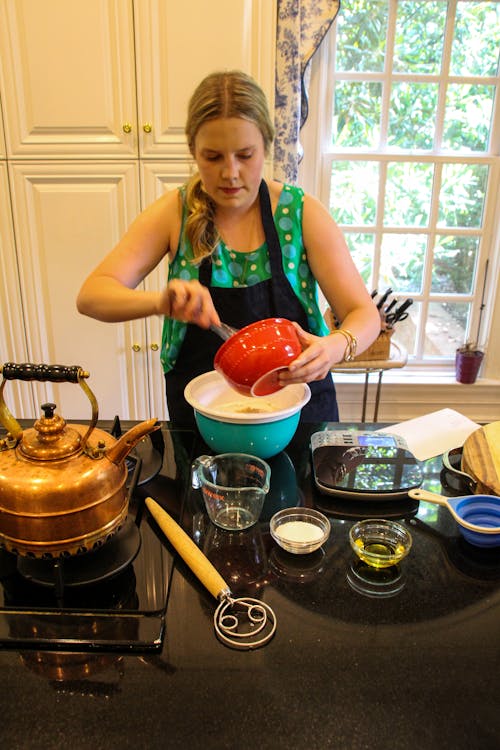 Woman in Black Apron Preparing Food