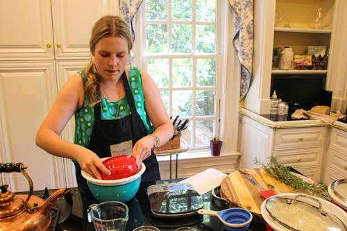 Woman holding Red Plastic Container