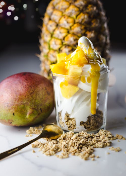 A Glass with Yogurt and Mango Slices