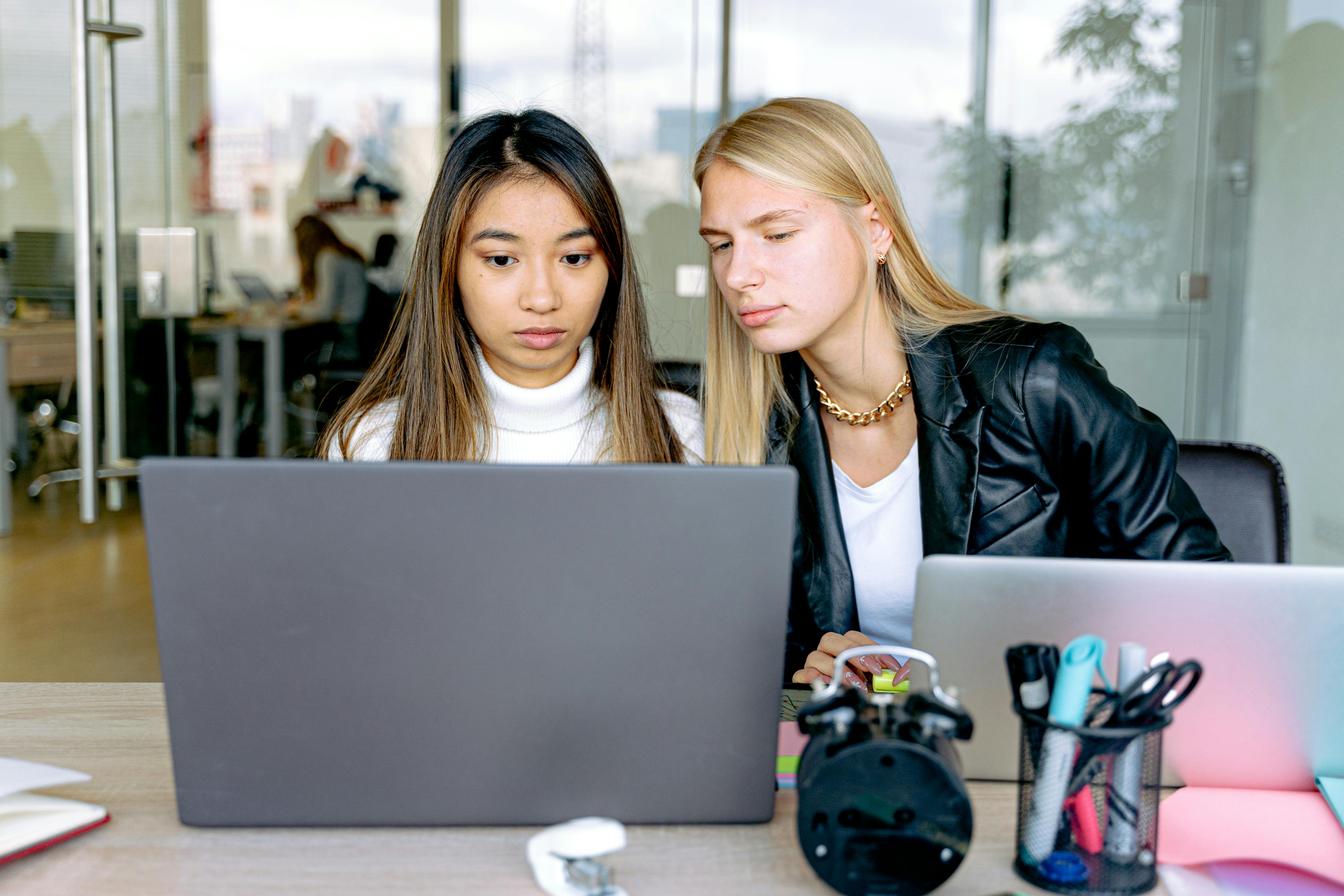 2 Women Sitting at the Table