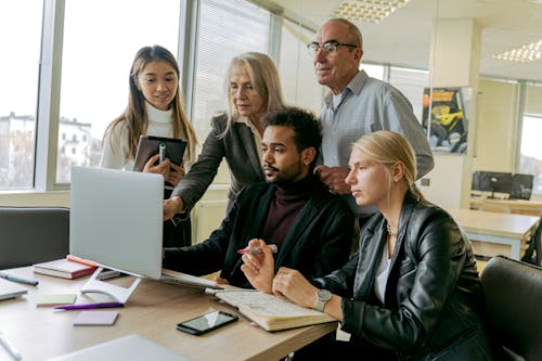 A Group of People Having a Meeting in the Office