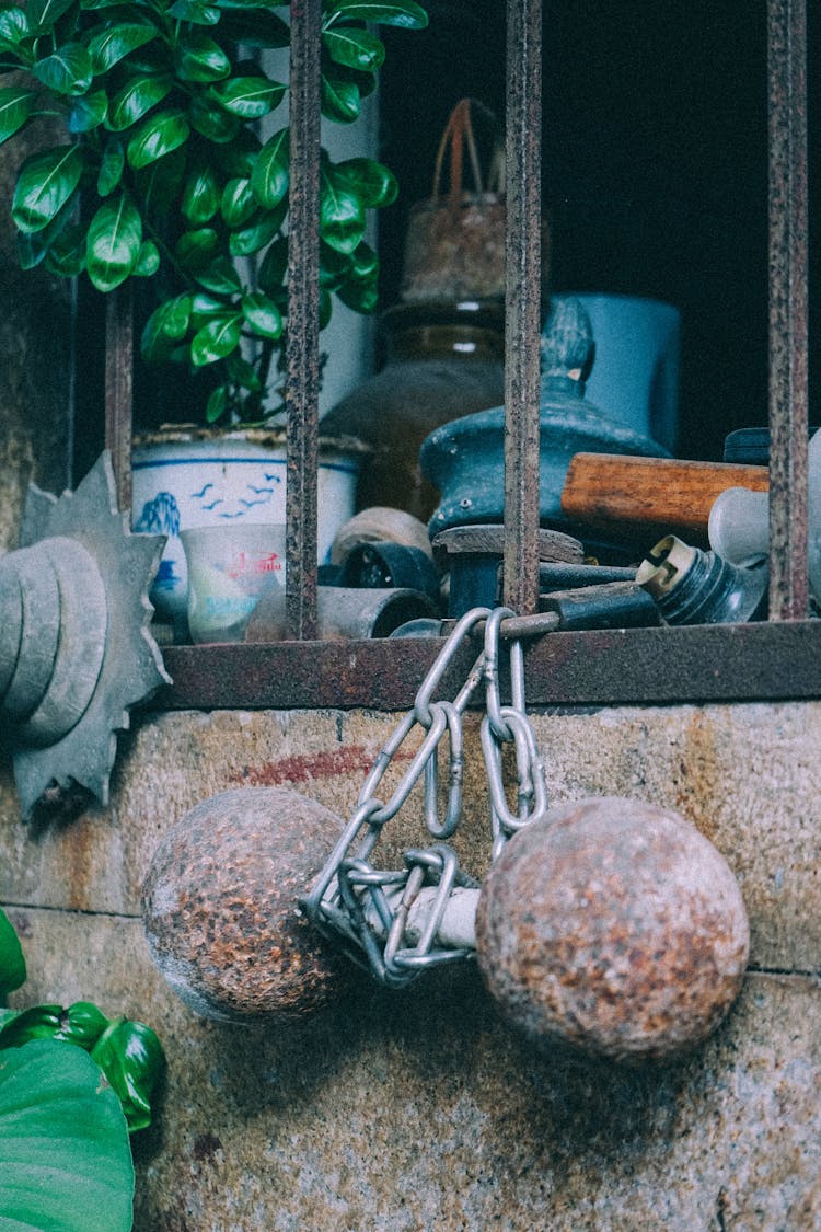 Weight Hanging From A Window On A Chain