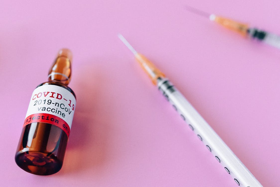 Free 2019 Ncov Vaccine In Brown Vial Stock Photo