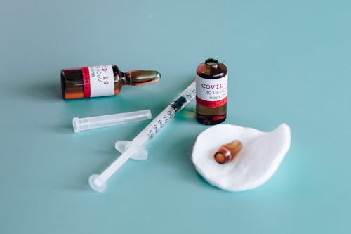 Free Covid-19 Vaccine Ampoules and Syringe Stock Photo