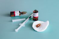 Covid-19 Vaccine Ampoules and Syringe