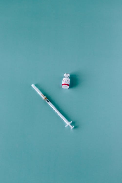 Free Covid-19 Vaccine and Syringe Stock Photo