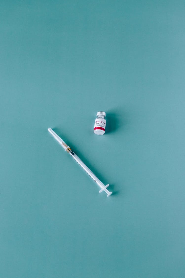 Covid-19 Vaccine And Syringe