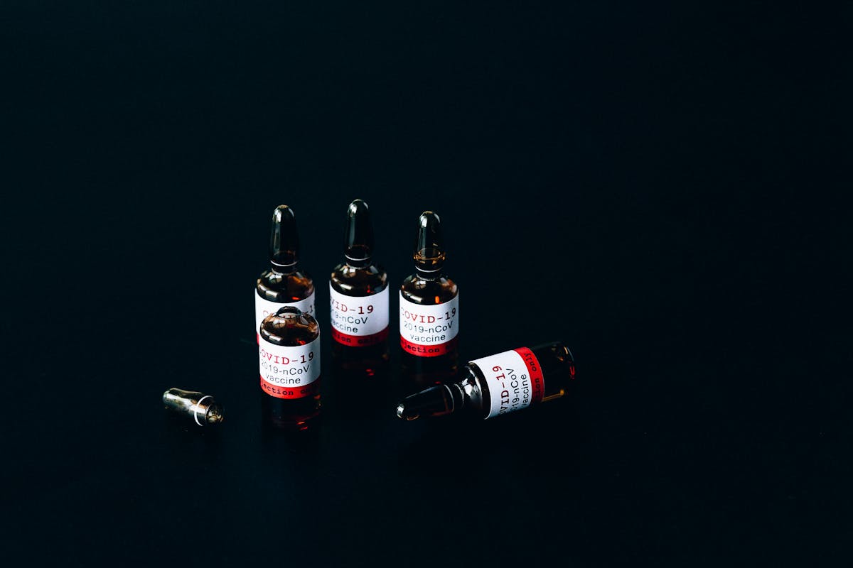 Person holding their arm after vaccination