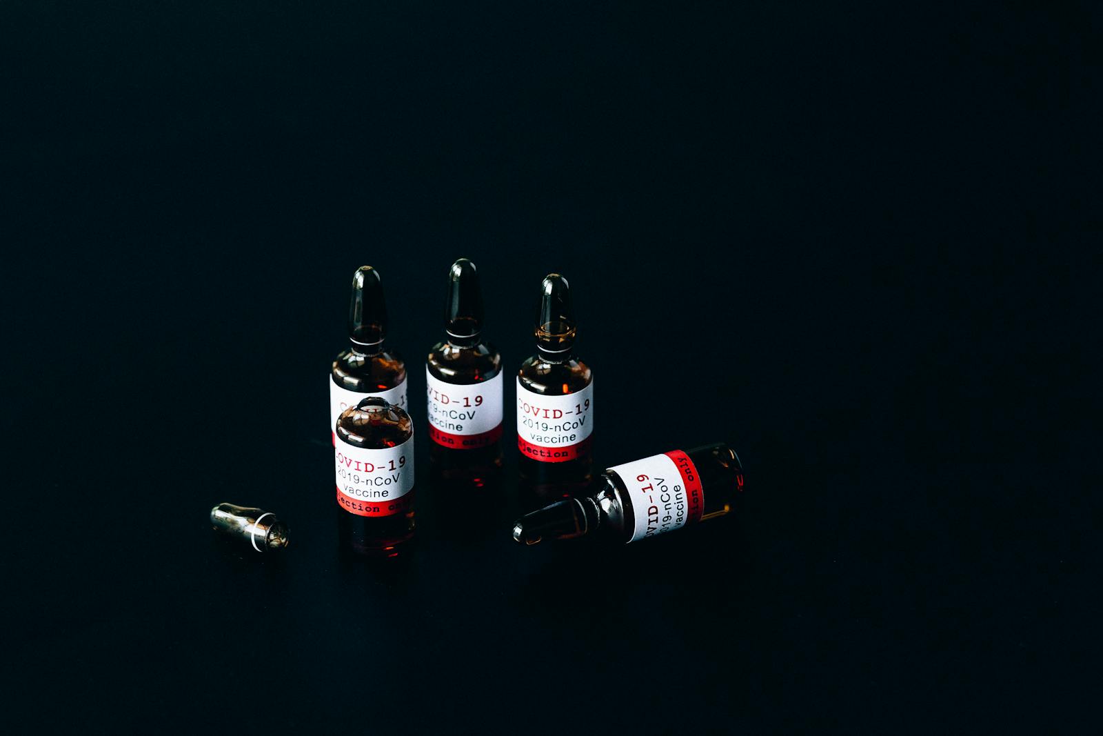 Older man coughing and holding his chest before vaccination