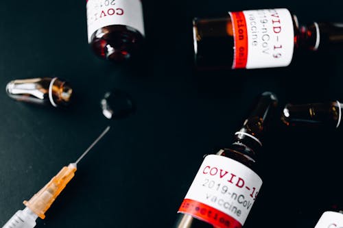 Free Three Small Glass Bottle and A Syringe Stock Photo