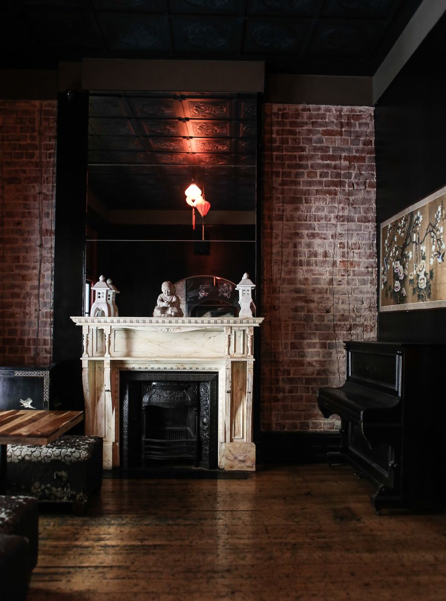 Sophisticated dining room with fireplace and warm ambient lighting