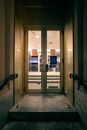 Concrete doorstep of glass doorway with handrails